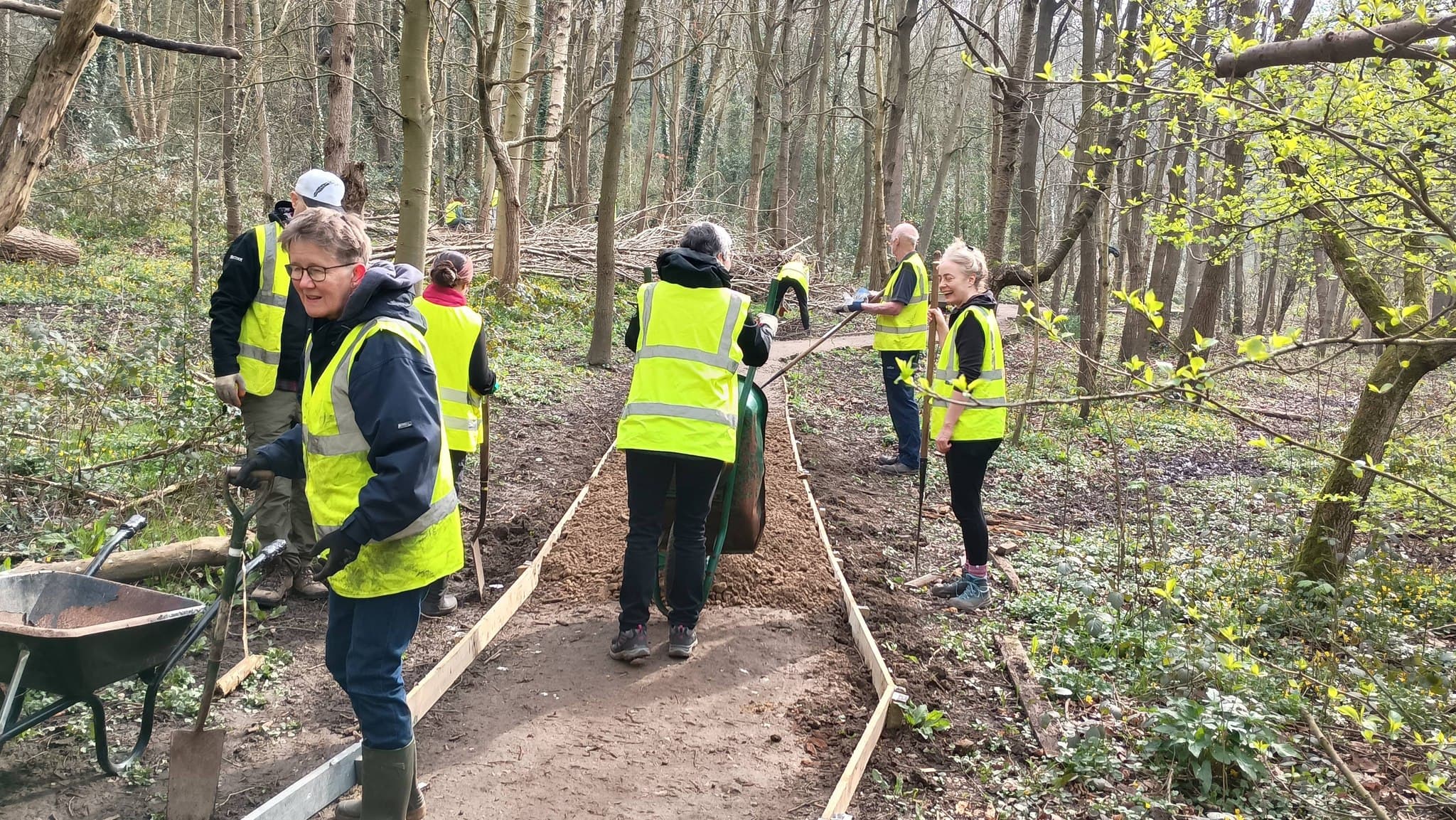 Community volunteers working in a woodland